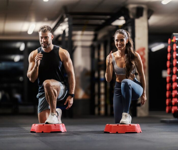 A,Muscular,Couple,In,Shape,Is,Exercising,Gluteus,And,Legs A,Muscular,Couple,In,Shape,Is,Exercising,Gluteus,And,Legs